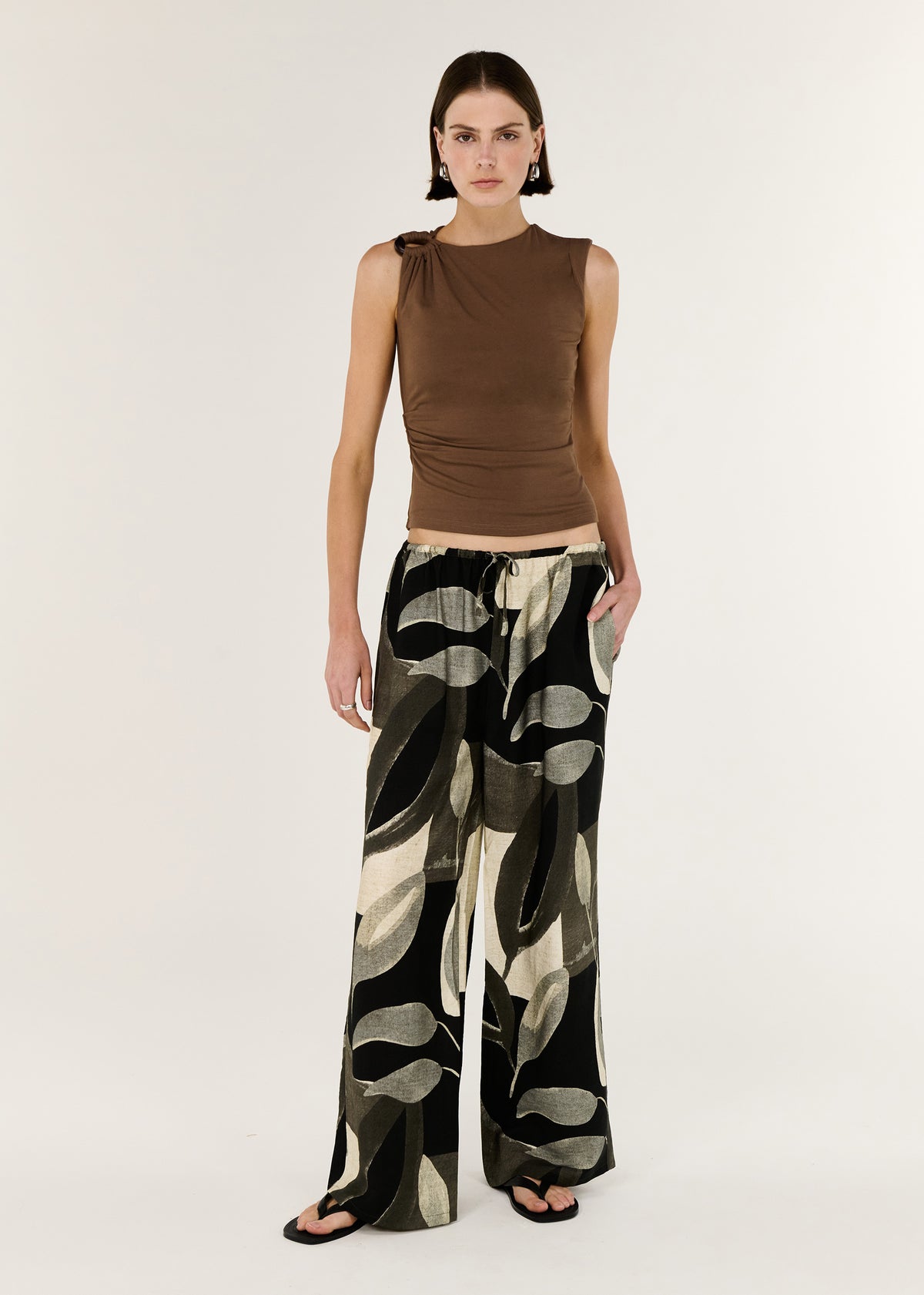 Model wearing Dark Leaf Relaxed Wide-Leg Pant with a relaxed pant silhouette and a fluid drape through the leg.