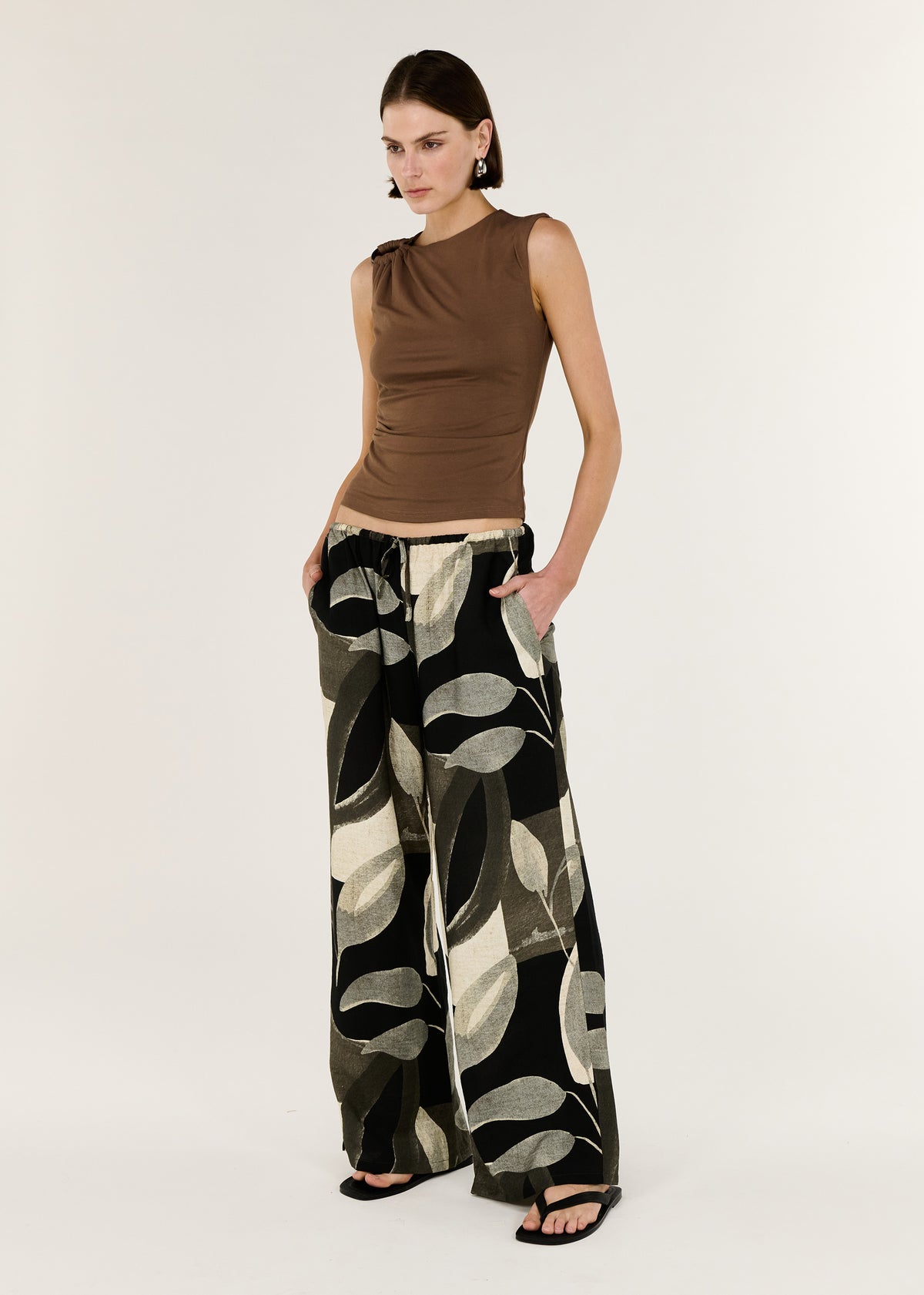 Model wearing Dark Leaf Relaxed Wide-Leg Pant with a made and a relaxed pant silhouette.