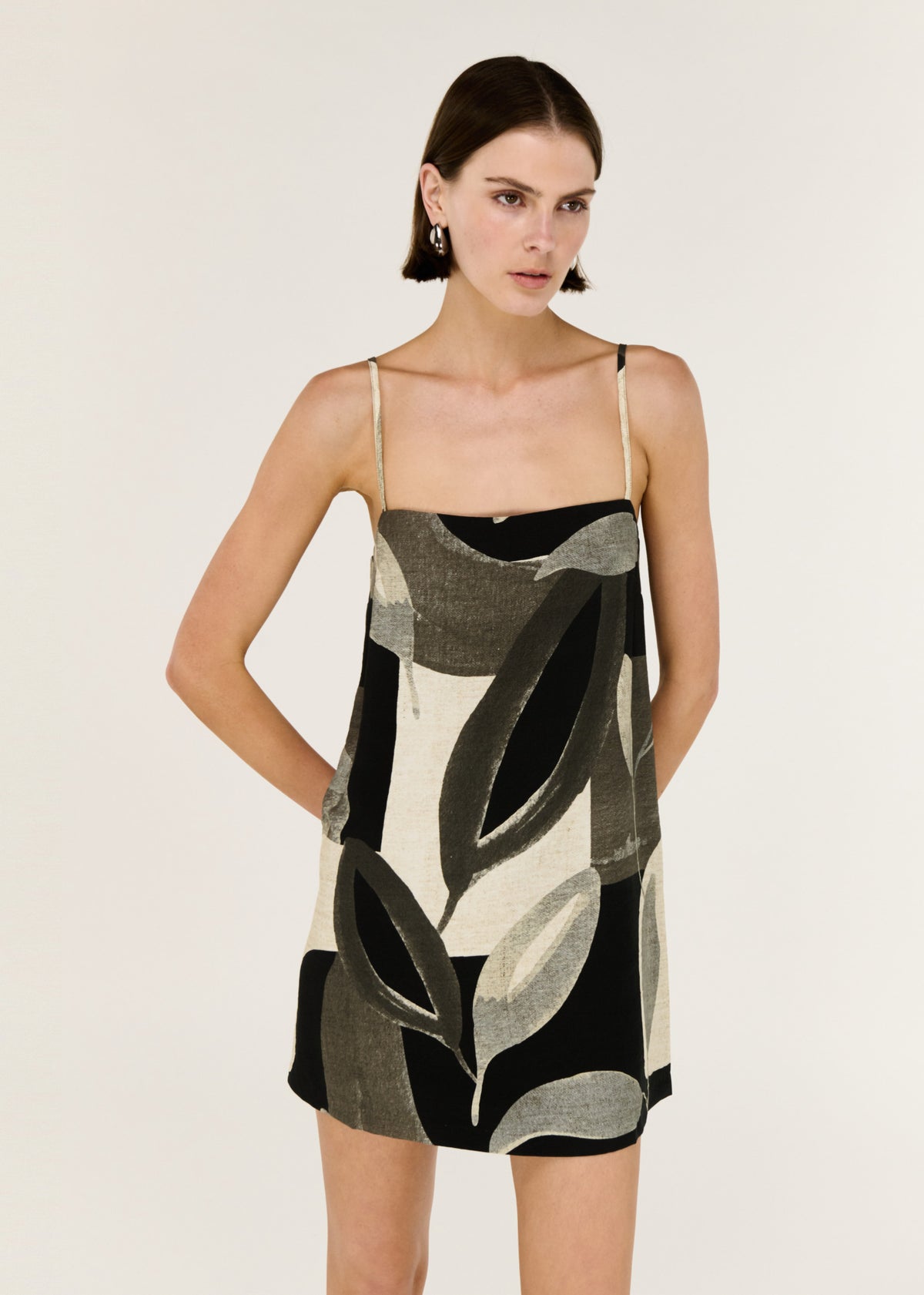 Close-up of the Dark Leaf Shift Mini Dress, showing a straight neckline and a relaxed trapeze silhouette.
