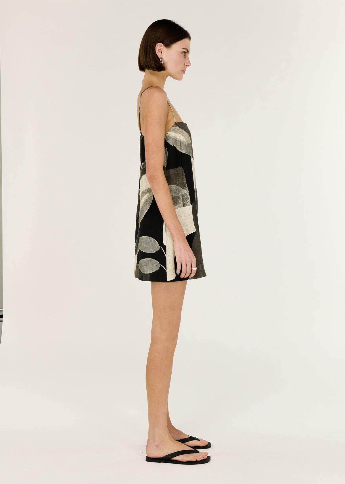 Side view of the Dark Leaf Shift Mini Dress, showing a made and a relaxed trapeze silhouette.