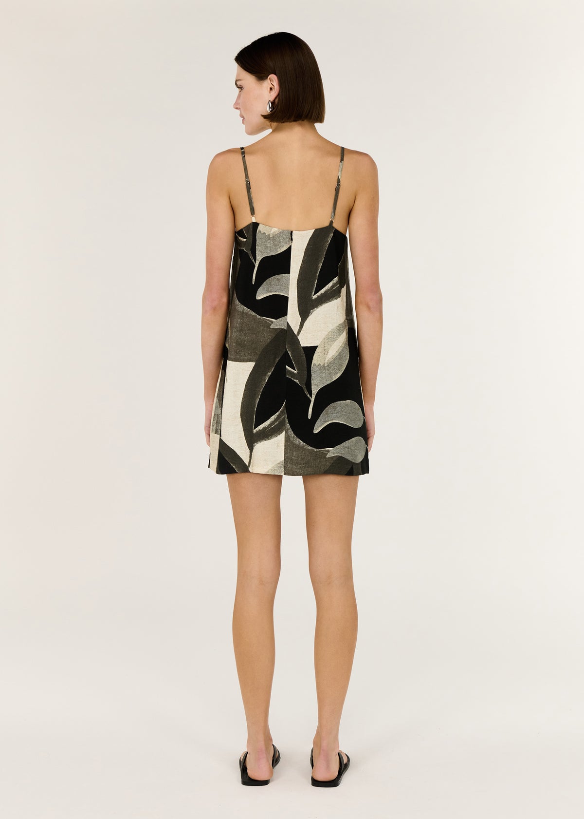 Back view of the Dark Leaf Shift Mini Dress with a relaxed trapeze silhouette and a straight neckline.