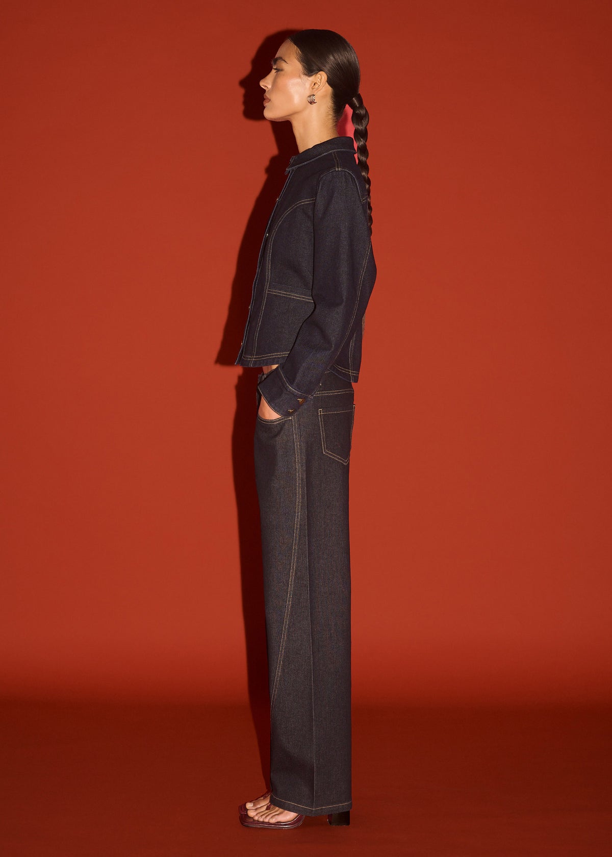 Side view of the Dark Wash Straight Leg Jeans, showing a structured denim feel and a mid-rise waist.
