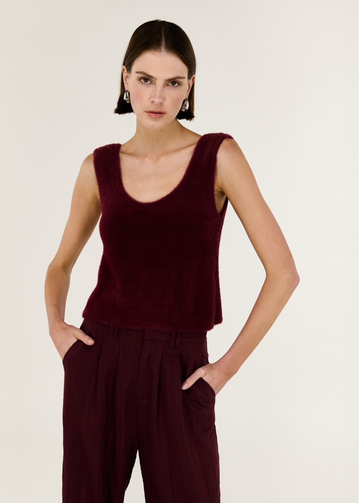 Close-up of the Deep Red Plush Cotton Knit Tank, showing a sleeveless cut and a scoop neckline.
