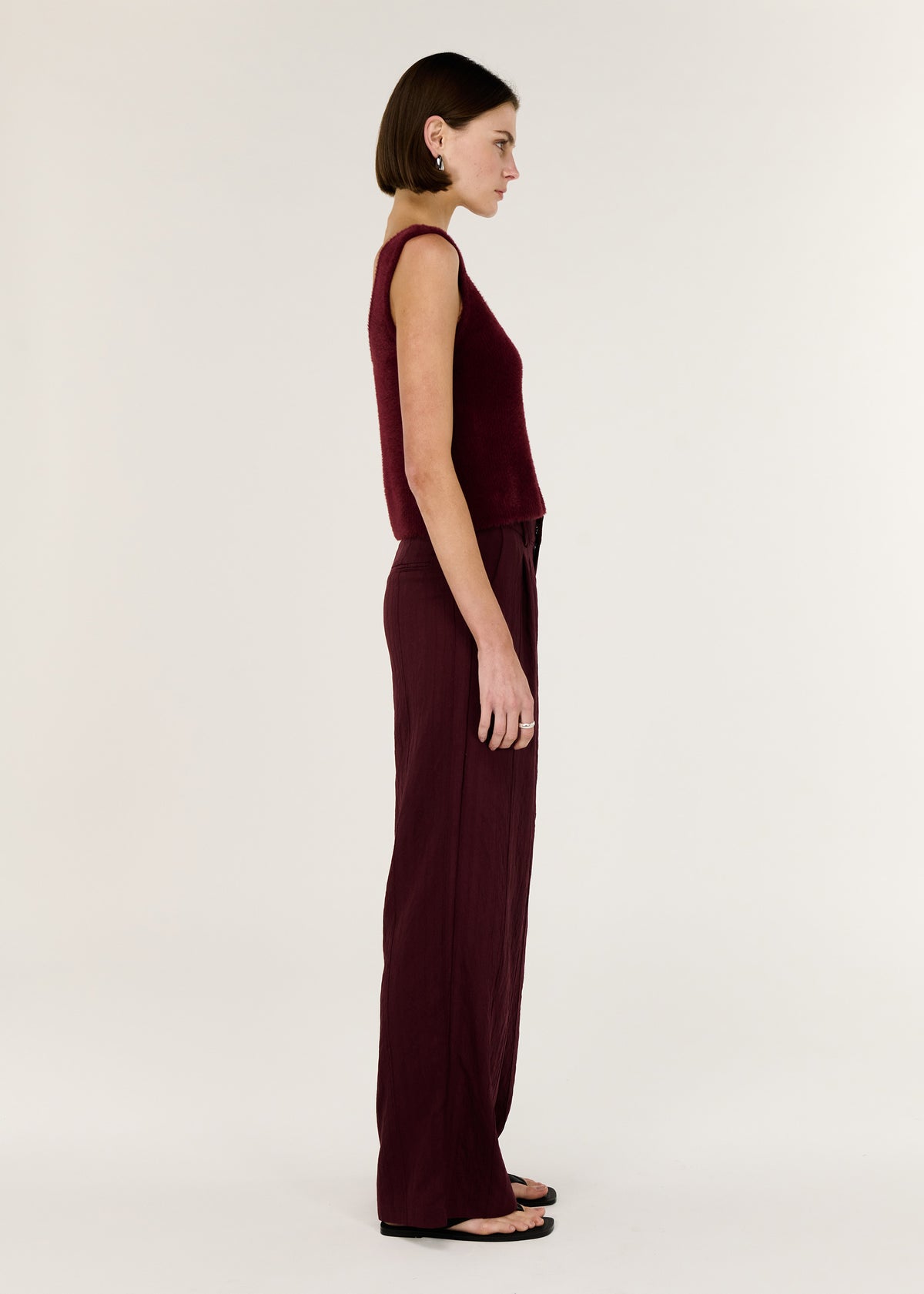 Side view of the Deep Red Plush Cotton Knit Tank, showing an easy layering essential and a colour: Shiraz.