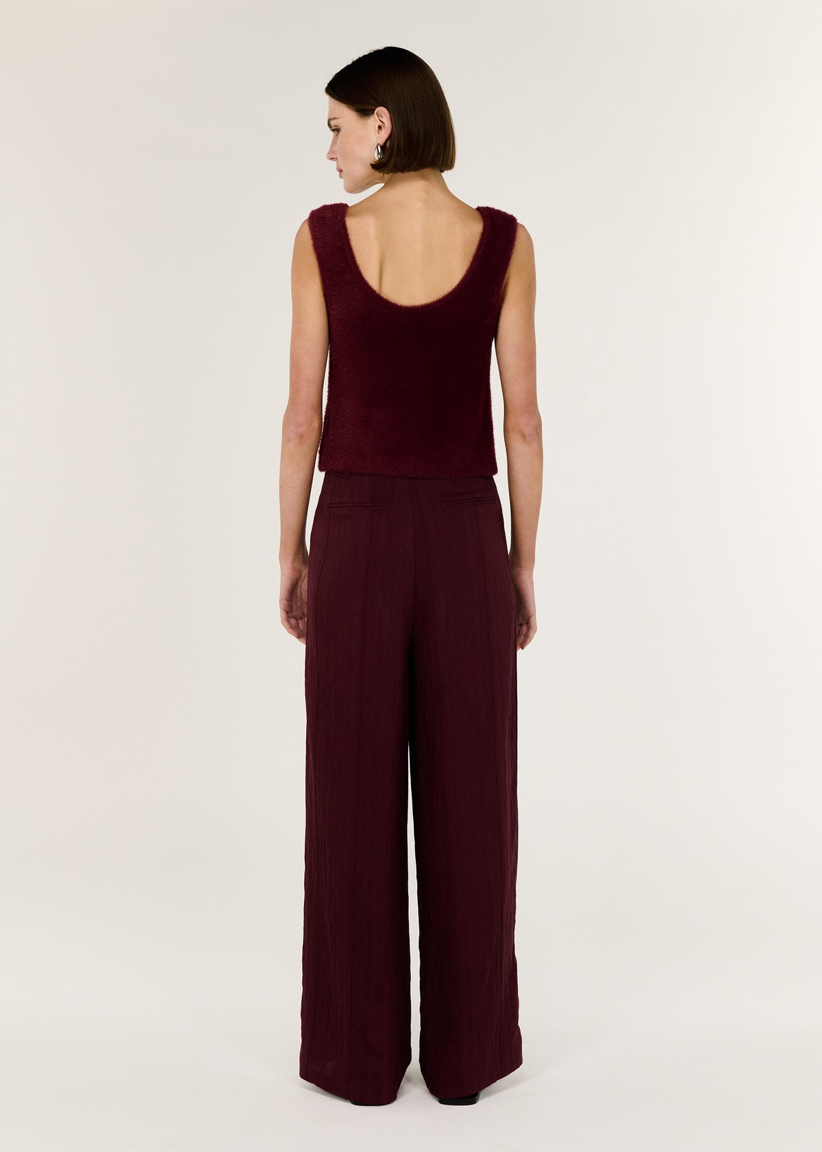 Back view of the Deep Red Plush Cotton Knit Tank with a sleeveless cut and a soft, fluffy cotton texture.