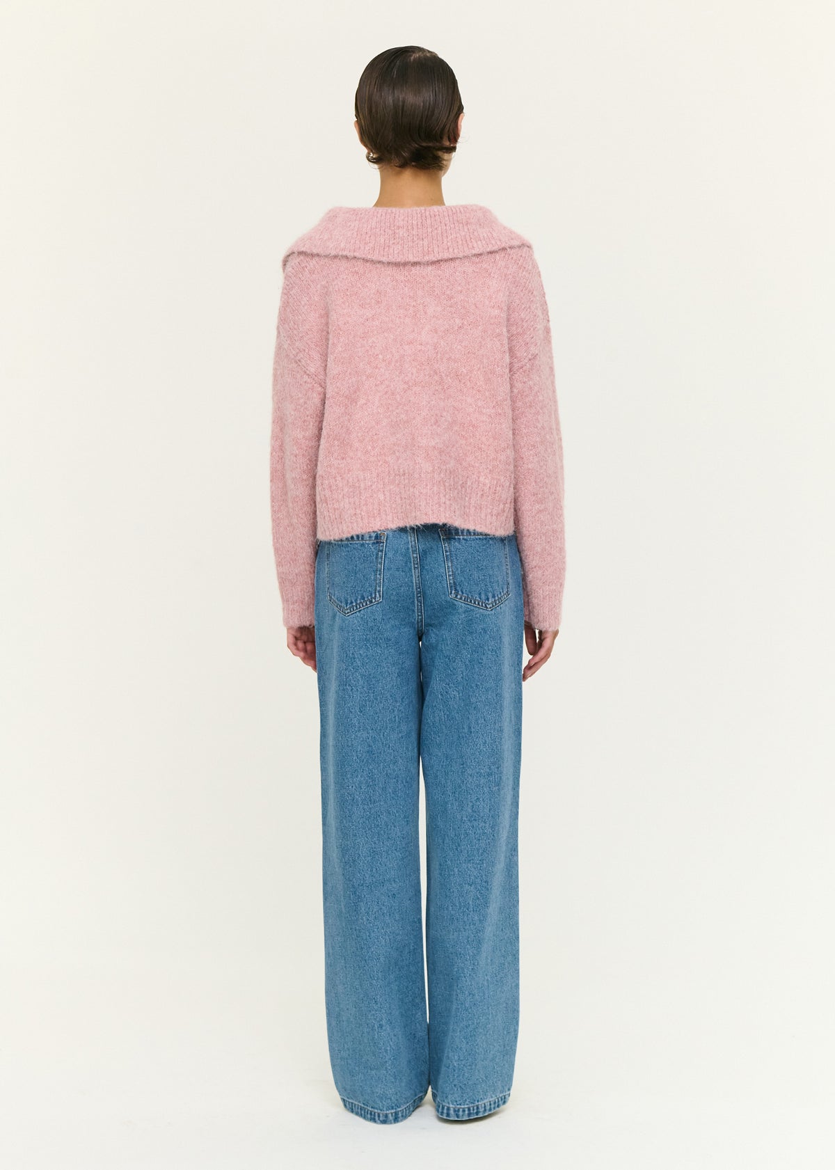 Back view of the Dusky Pink Fluffy Knit Polo Jumper with an open neckline detail and a soft fluffy knit fabrication.