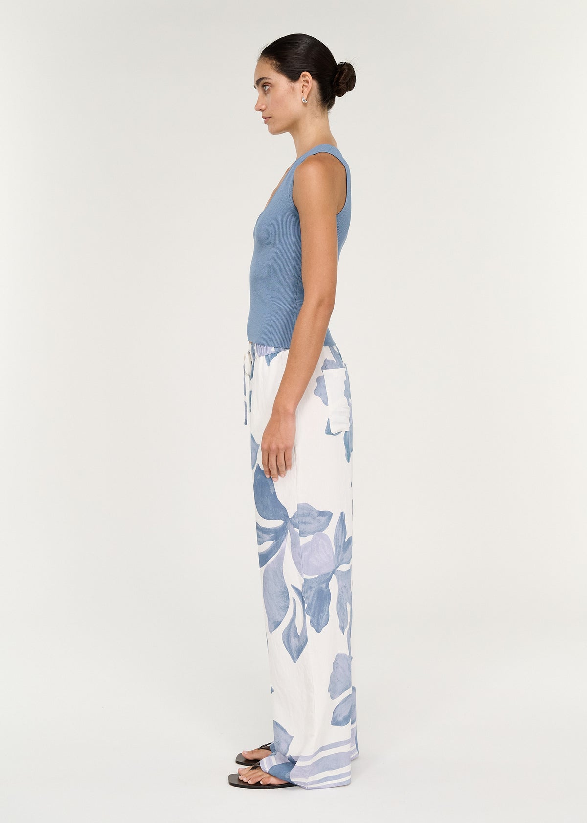 Model showcasing Relaxed Drawstring Pant in Blue Floral with wide-leg silhouette and side pockets.