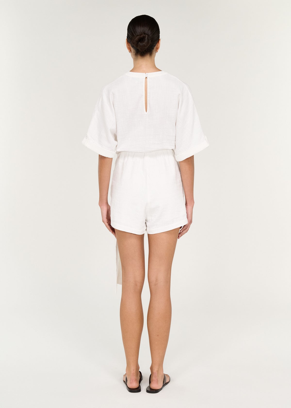 Back view of Cotton Linen Blend Wrap Playsuit with Tie Detail showing textured fabric and self-tie sash.