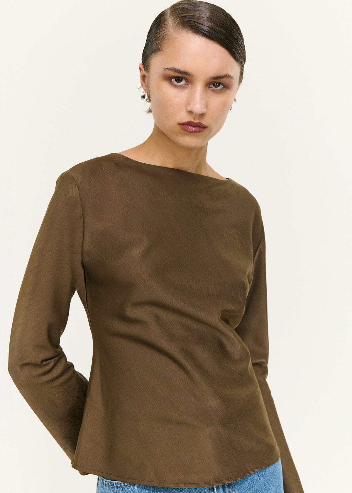 Close-up of the Espresso Bias Cut Boat Neck Top, showing a boat neckline and long sleeves.