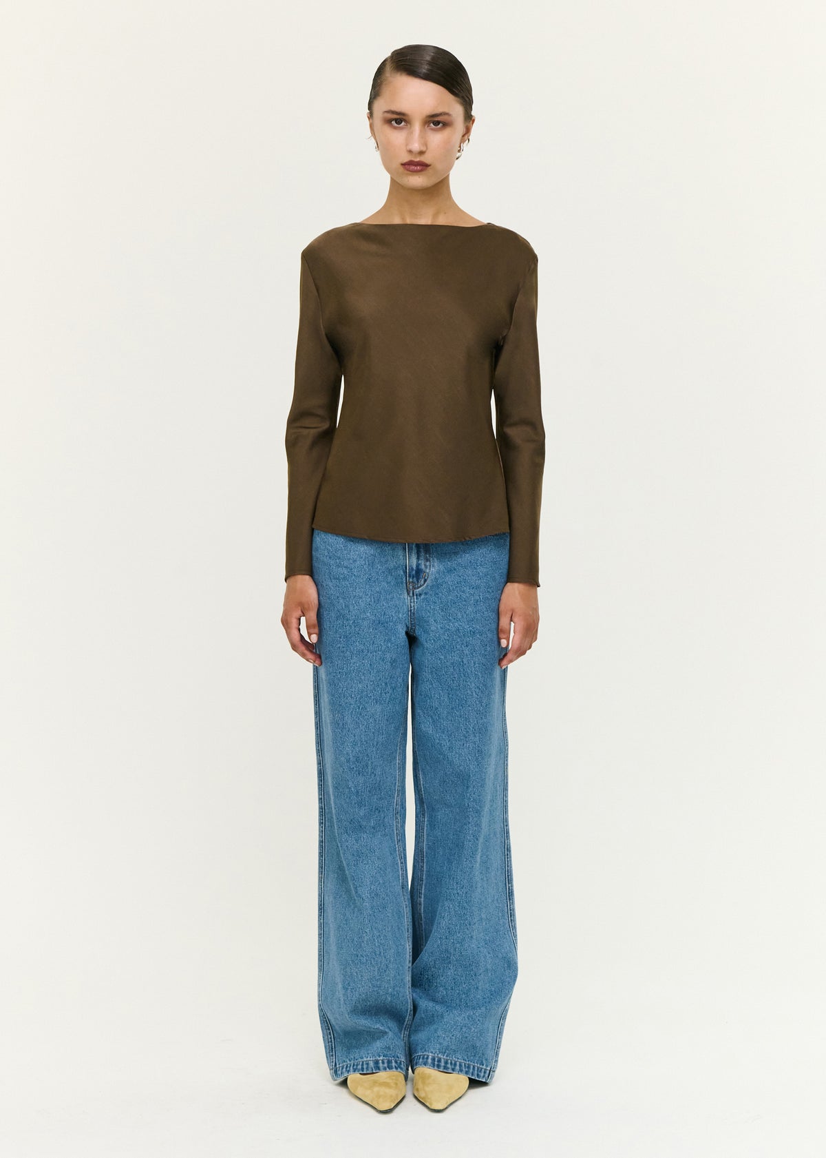 Model wearing Espresso Bias Cut Boat Neck Top with a boat neckline and long sleeves.