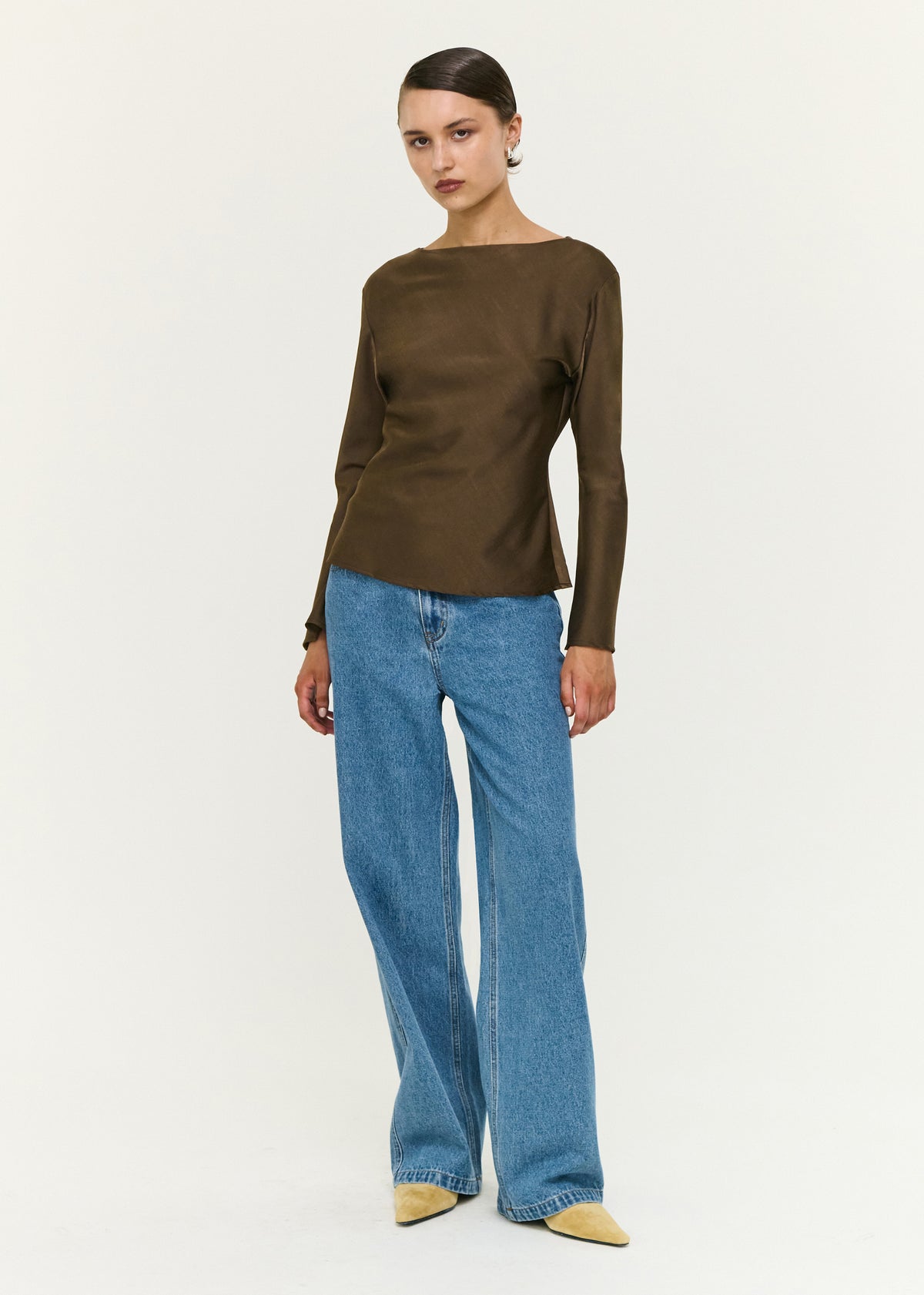 Model wearing Espresso Bias Cut Boat Neck Top, showing a subtle sheen finish and a slim fit.