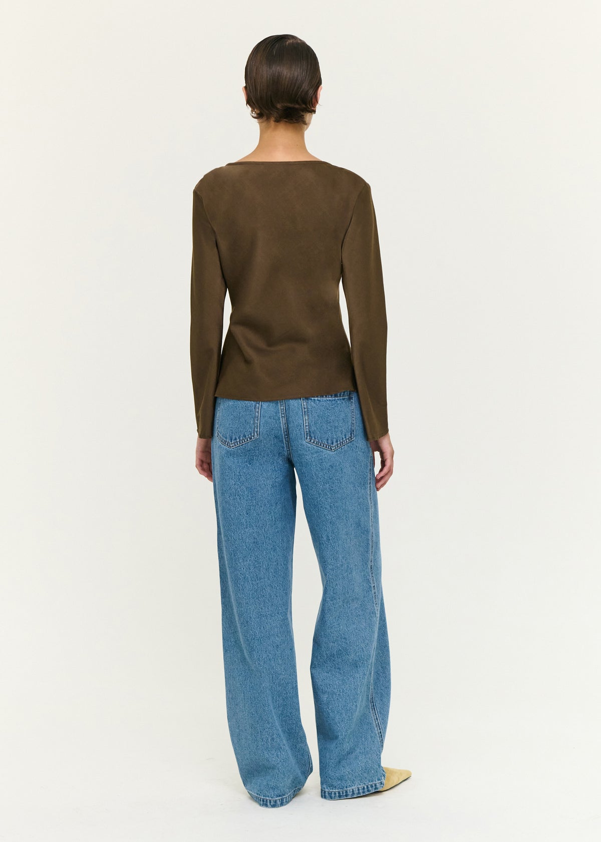 Back view of the Espresso Bias Cut Boat Neck Top with a soft woven fabrication and a bias-cut silhouette.