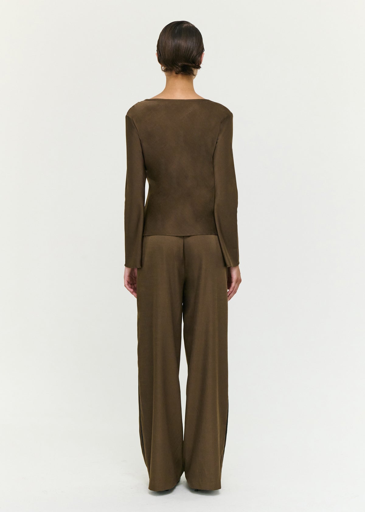 Back view of the Espresso Relaxed Cut Silky Pant with a soft woven fabrication and a relaxed wide leg silhouette.
