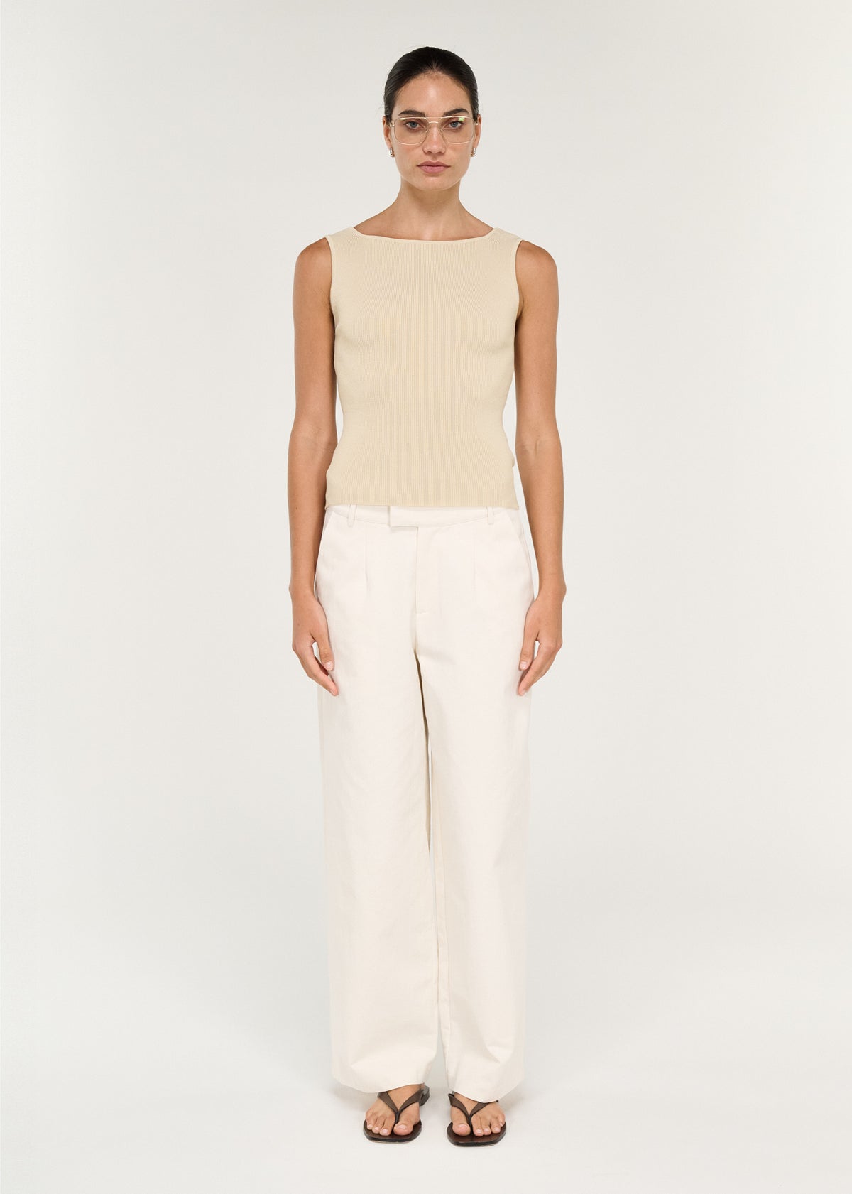 Model wearing Fine Rib Knit Reversible Tank in Ecru, showing two neckline options and a boat neckline.