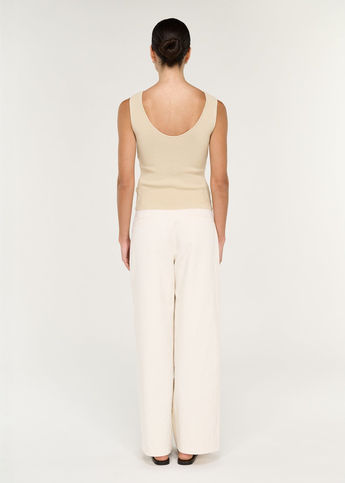 Back view of the Fine Rib Knit Reversible Tank in Ecru with a fine ribbed knit fabrication and a reversible design.