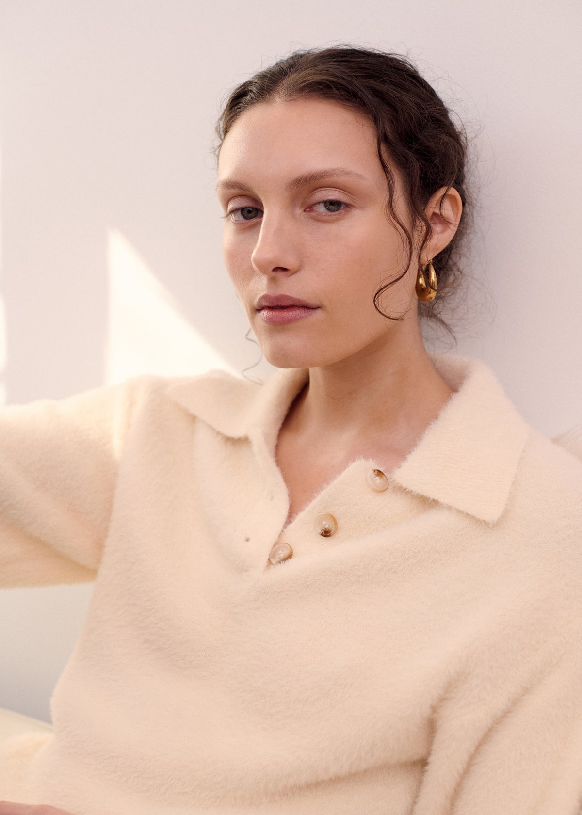 Close-up detail of the Fluffy Knit Polo Top in Cream, showing collar and buttons.