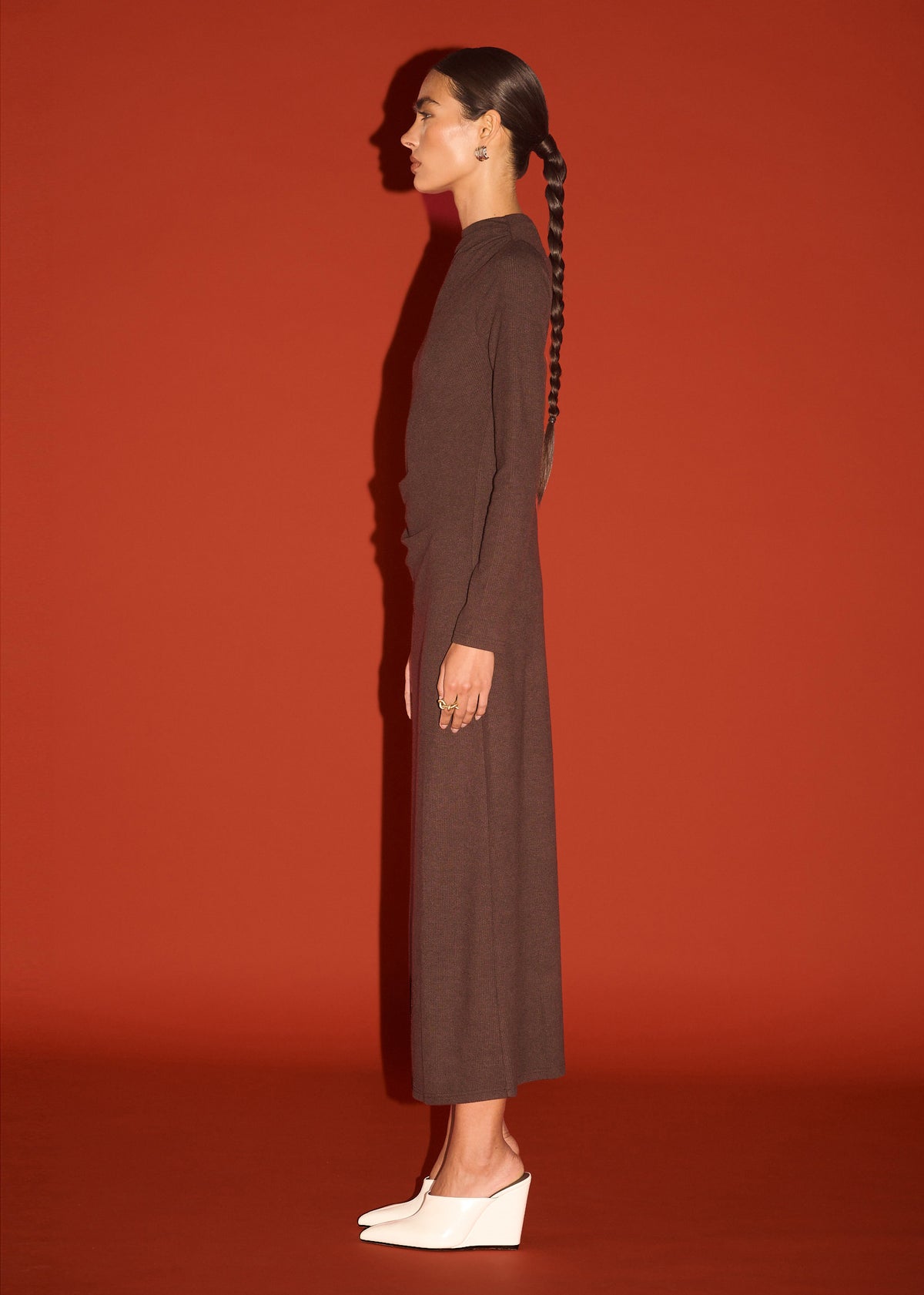Side view of the Gather Detail Long Sleeve Jersey Midi Dress in Chocolate, showing a pull-on style and a soft stretch fabrication.