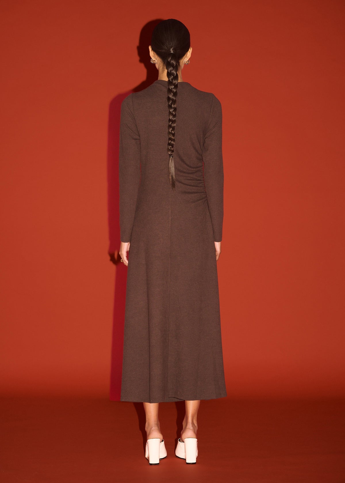 Back view of the Gather Detail Long Sleeve Jersey Midi Dress in Chocolate with a soft stretch fabrication and a fitted silhouette.