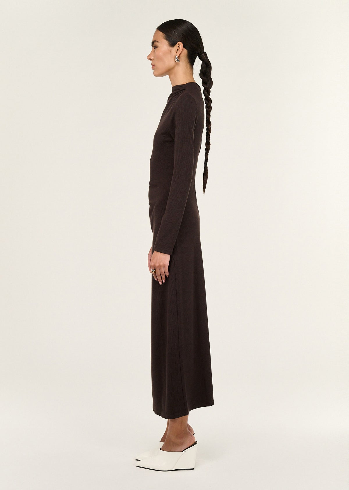 Side profile of the Gather Detail Long Sleeve Jersey Midi Dress in Chocolate with a midi length and a pull-on style.