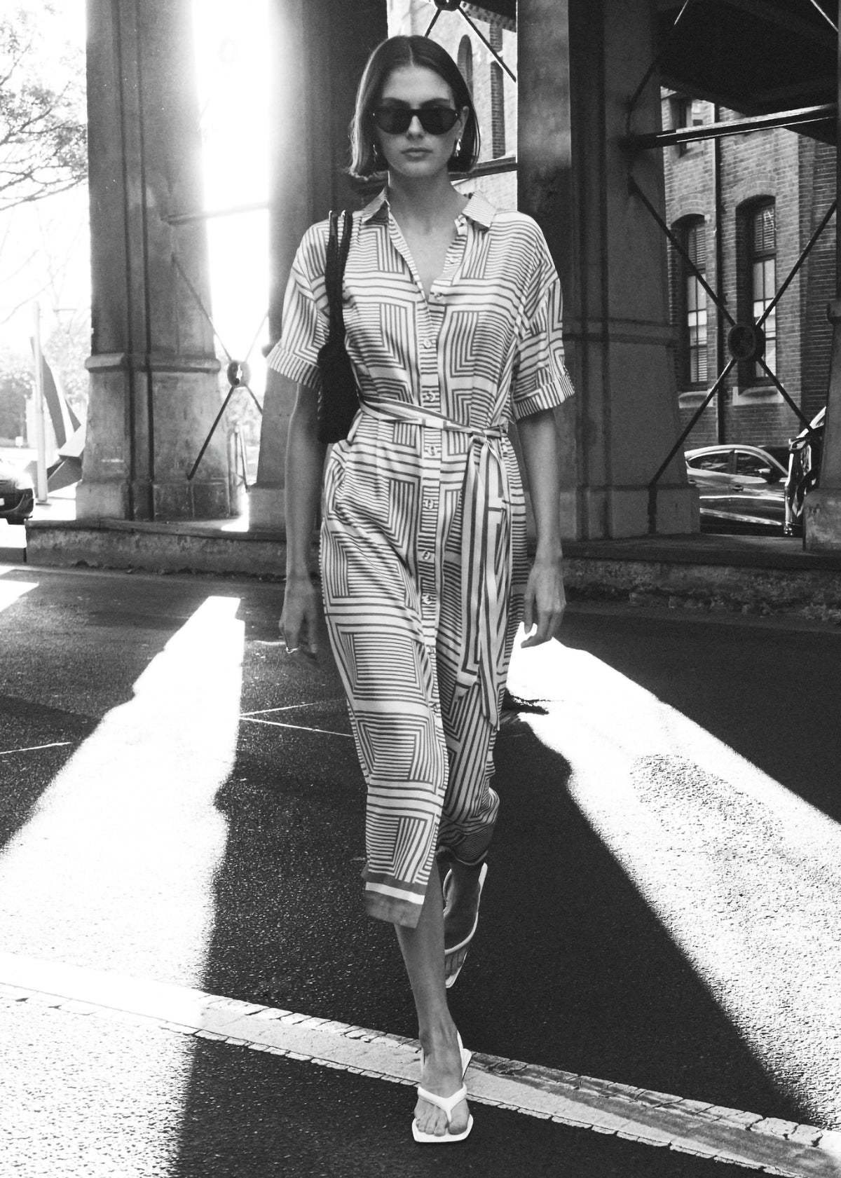 Model wearing Geometric Print Button Front Midi Shirt Dress, showing a classic collar and button-down front.