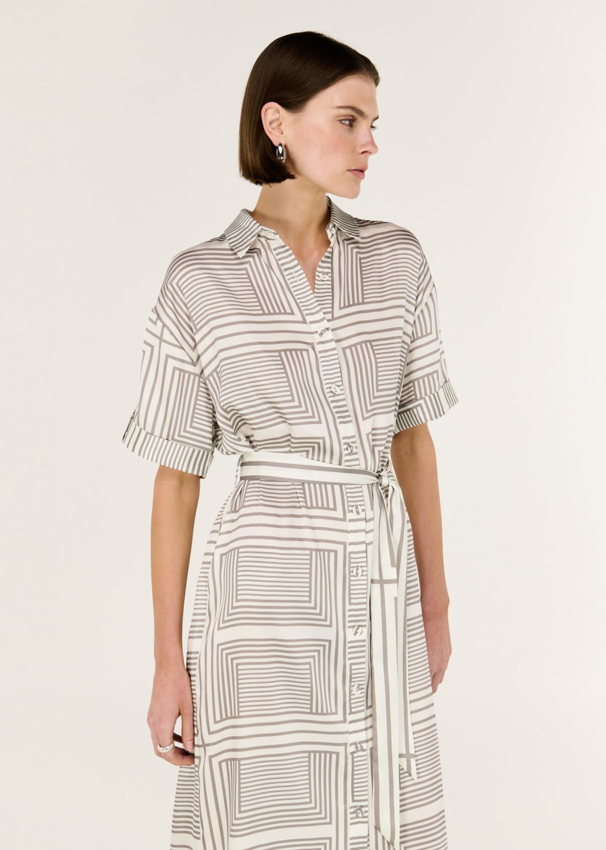 Close-up of the Geometric Print Button Front Midi Shirt Dress, showing a classic collar and button-down front.
