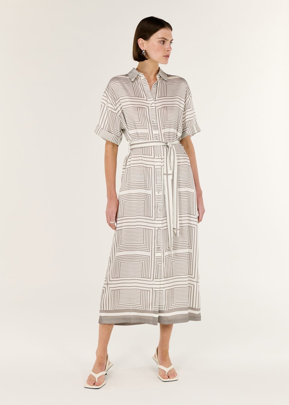 Model wearing Geometric Print Button Front Midi Shirt Dress with a subtle sheen and a midi-length shirtdress silhouette.