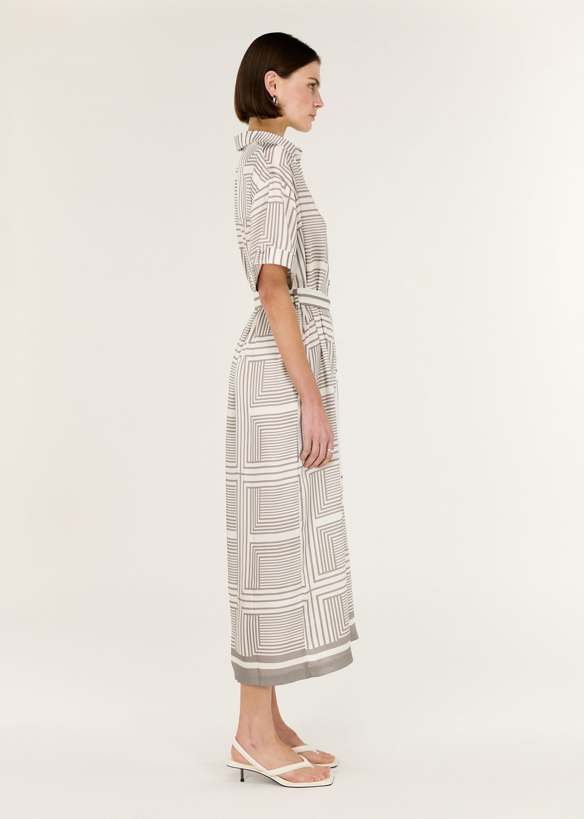 Side view of the Geometric Print Button Front Midi Shirt Dress, showing a classic collar and button-down front.