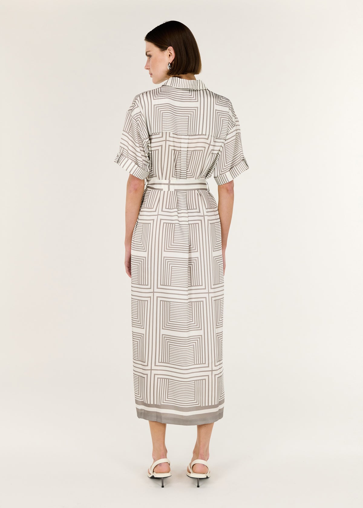 Back view of the Geometric Print Button Front Midi Shirt Dress with a classic collar and button-down front.