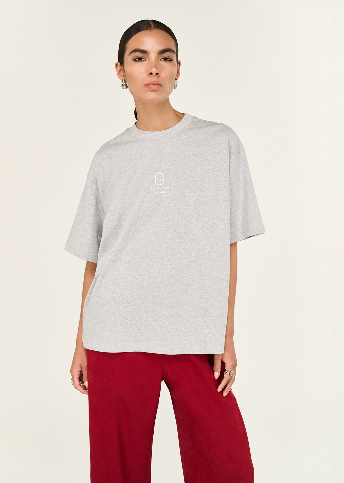 Close-up of the Grey Marle Cotton Embroidered Oversized Tee, showing a crew neckline and dropped shoulder seams.