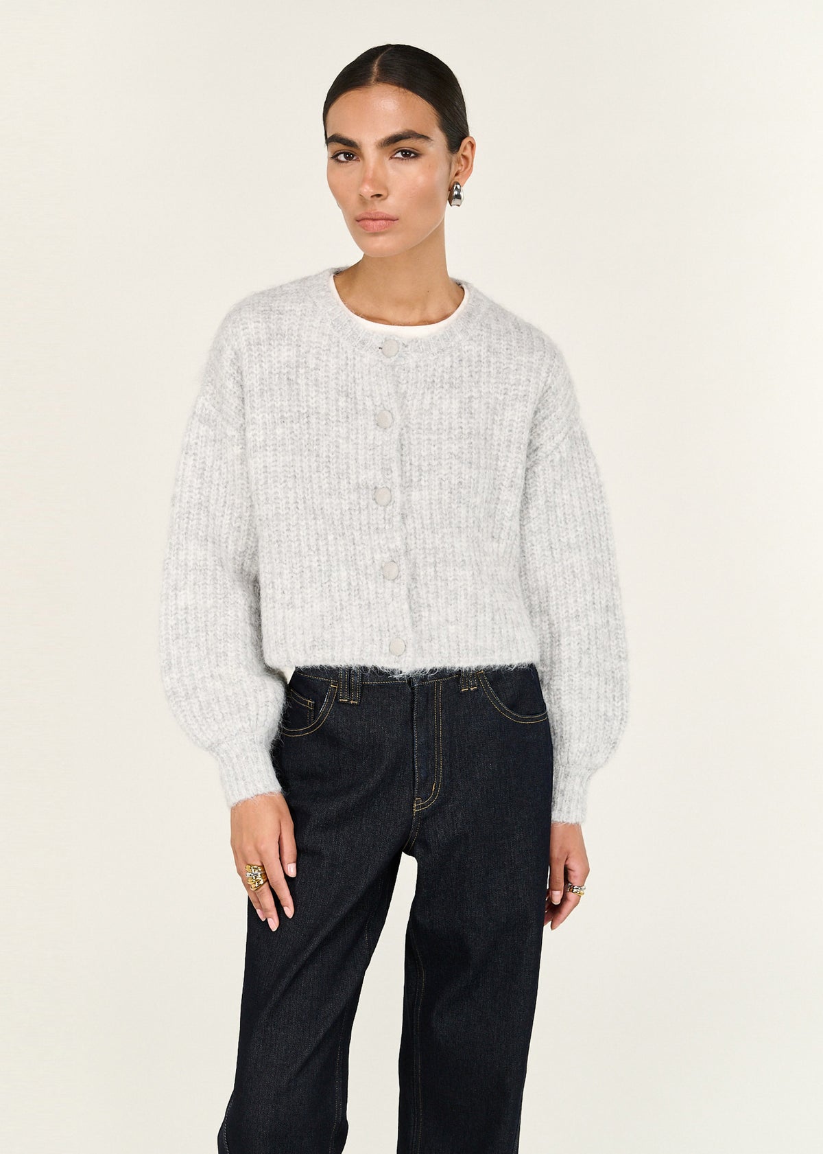 Close-up of the Grey Marle Cropped Knit Cardigan, showing a crew neckline and a button-through front.