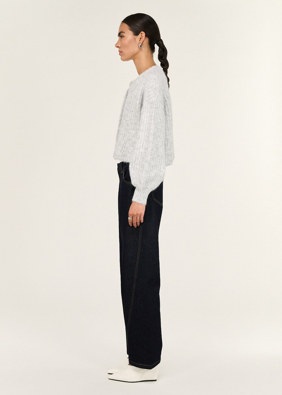 Side view of the Grey Marle Cropped Knit Cardigan, showing a ribbed cuffs and hem.