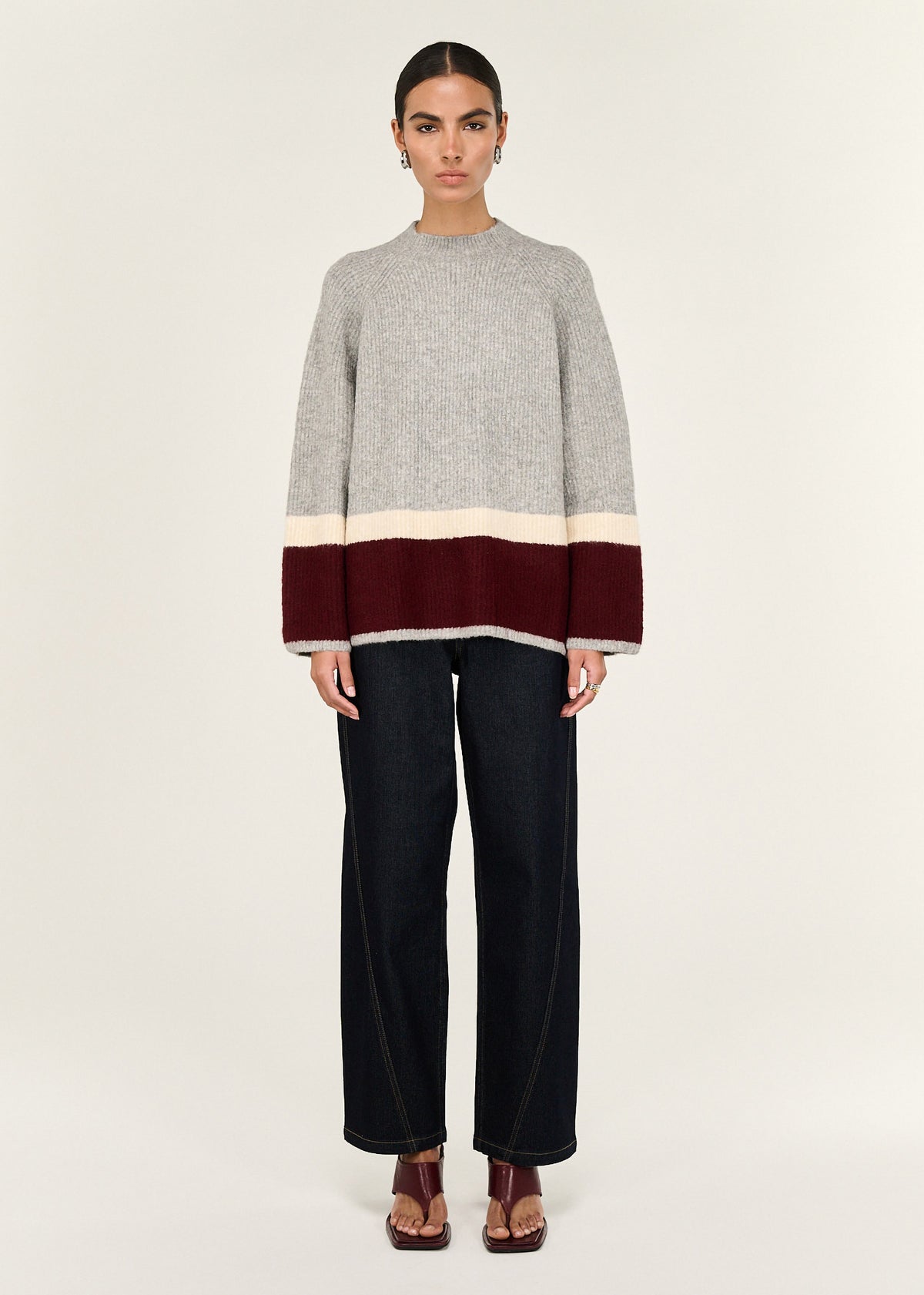 Model wearing Grey Raglan Heavy Knit Jumper with a relaxed silhouette.