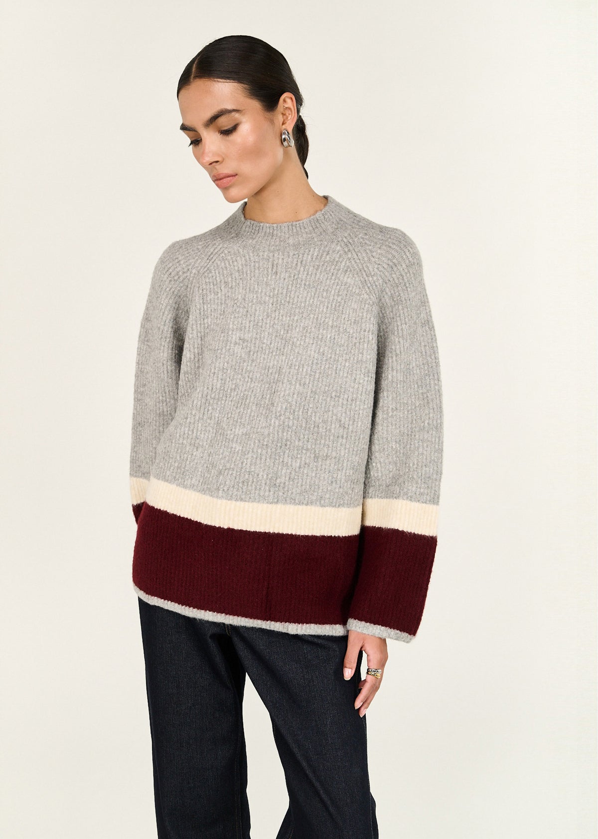 Close-up of Grey Raglan Heavy Knit Jumper with a crew neckline and a raglan sleeve construction.