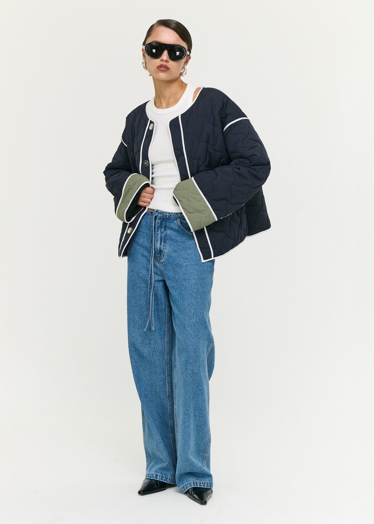 Model wearing Hollis Puffer Jacket with a lightweight quilted fabrication and a relaxed fit.