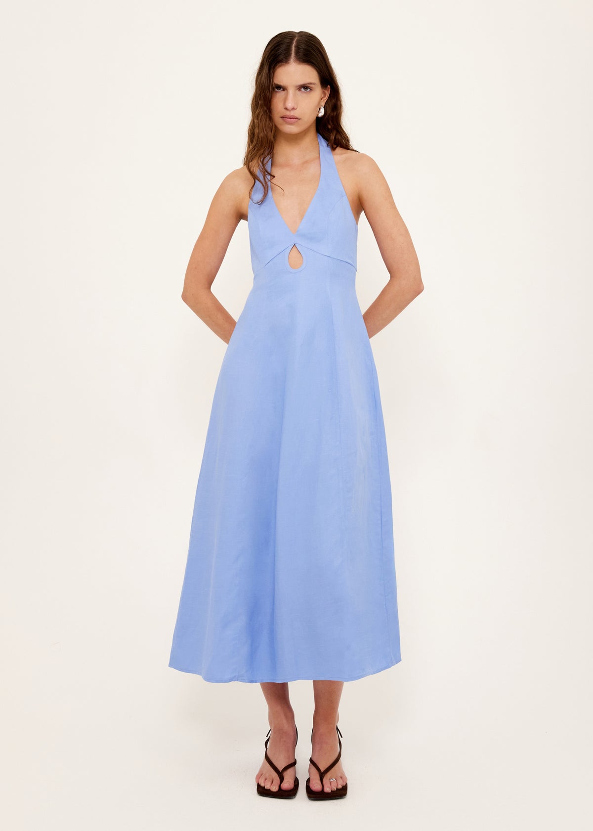 Model wearing Jacaranda Tencel Linen Blend Halter Midi Dress with a halter neckline with tie fastening and an open back with adjustable tie.