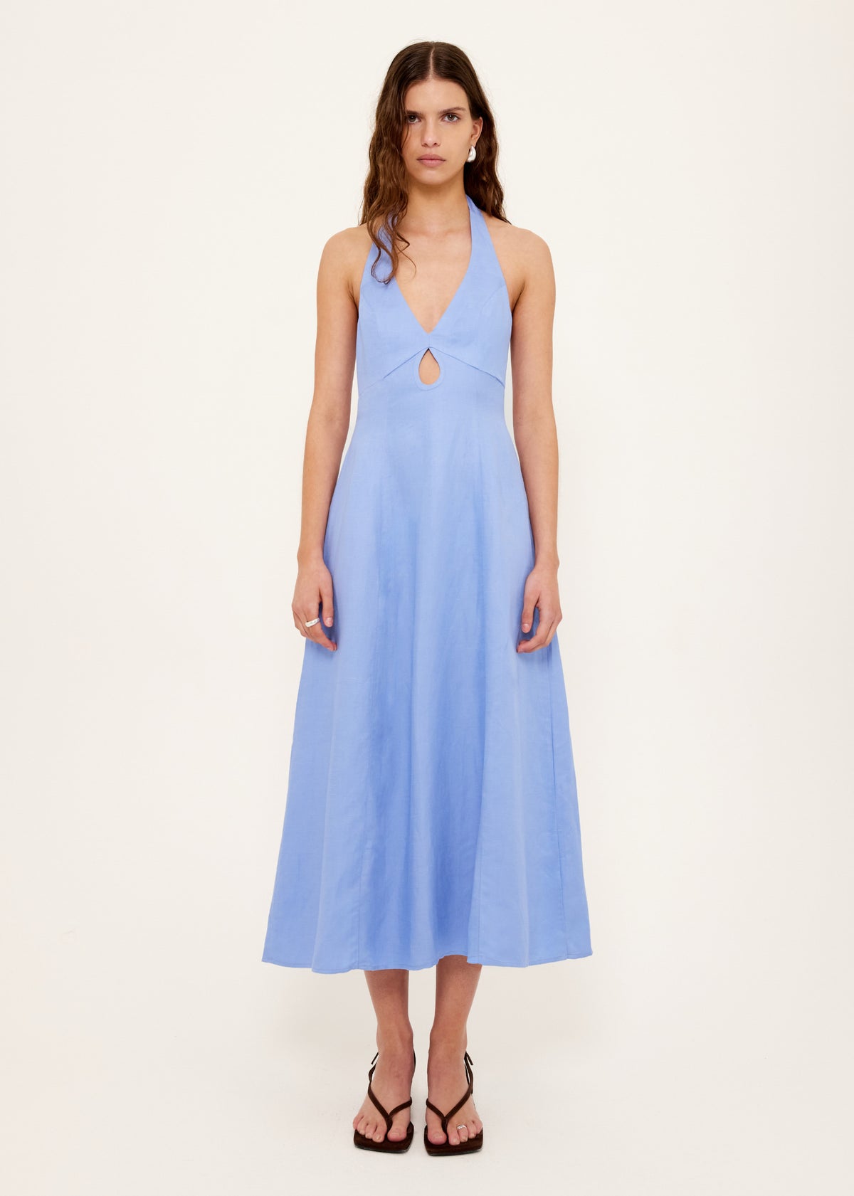 Model wearing Jacaranda Tencel Linen Blend Halter Midi Dress, showing a fully lined and an exclusive Jacaranda blue hue.