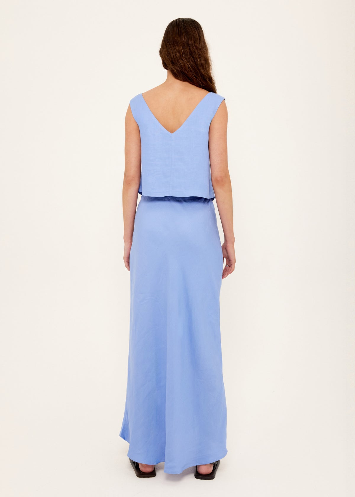 Back view of the Jacaranda Tencel Linen Blend Maxi Skirt with an elasticated waistband at back and a bias-cut silhouette.