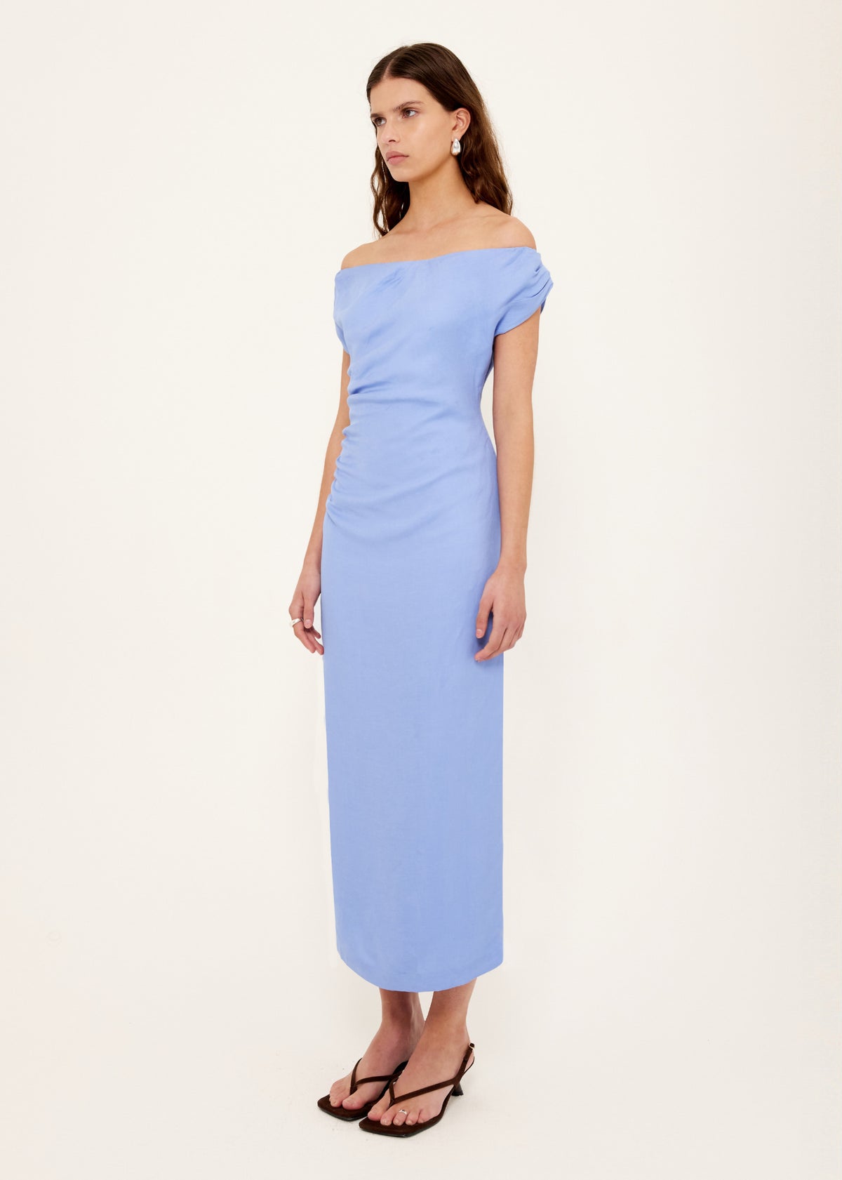 Model wearing Jacaranda Tencel Linen Blend Off-Shoulder Midi Dress, showing a jacaranda blue hue.