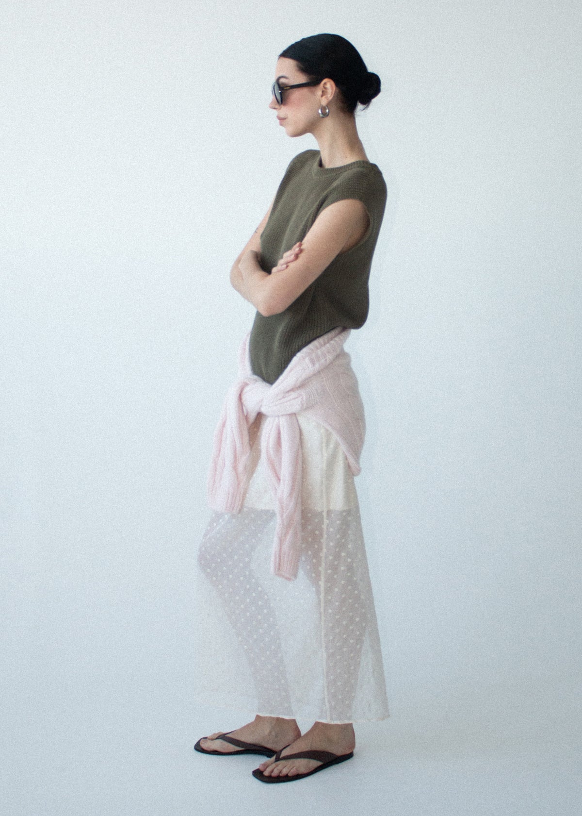 Side view of the Khaki Cotton Blend Knit Tank Top, showing a textured rib knit fabrication and a sleeveless silhouette.