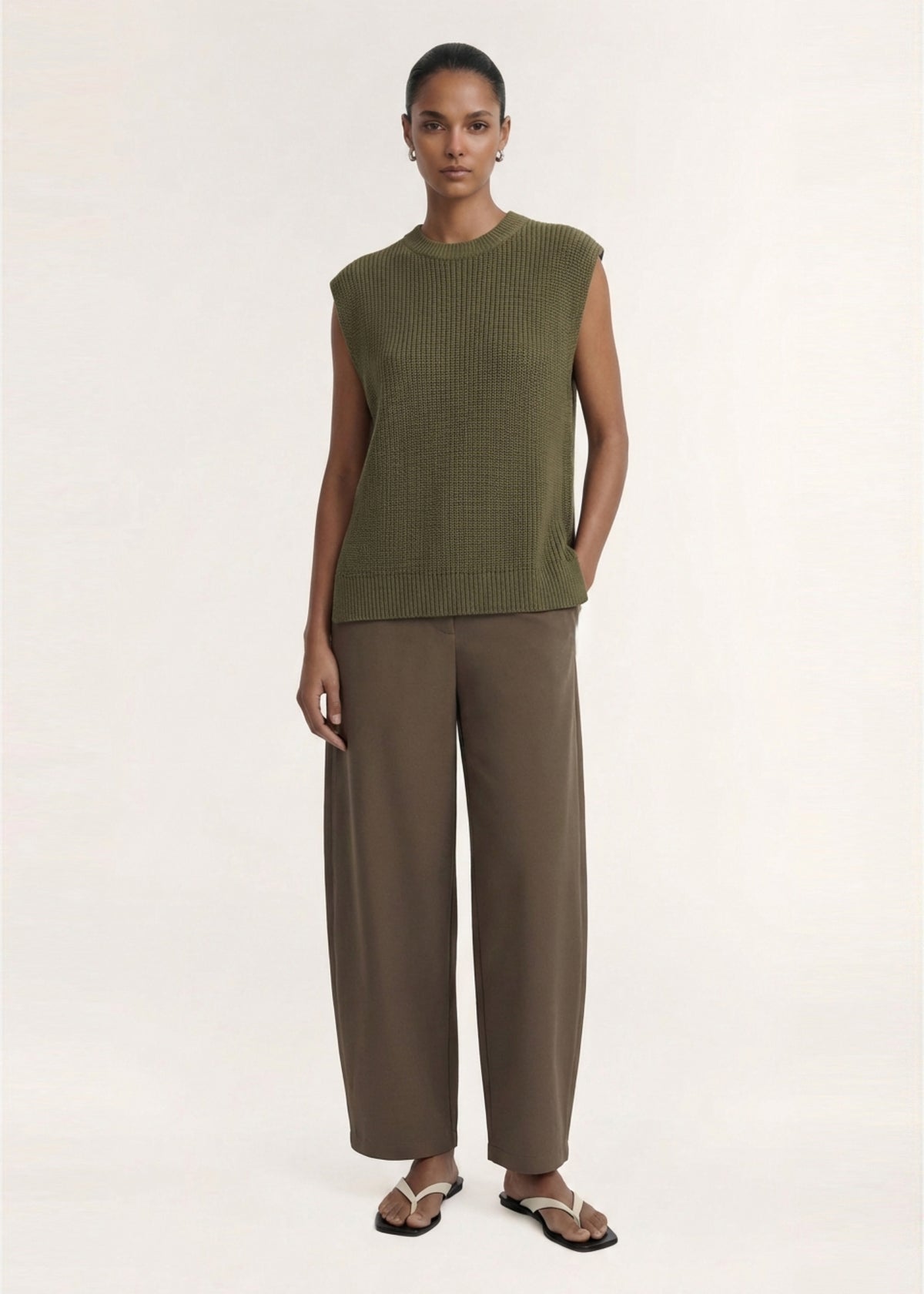 Model wearing Khaki Cotton Blend Knit Tank Top with a relaxed fit and a crew neckline.