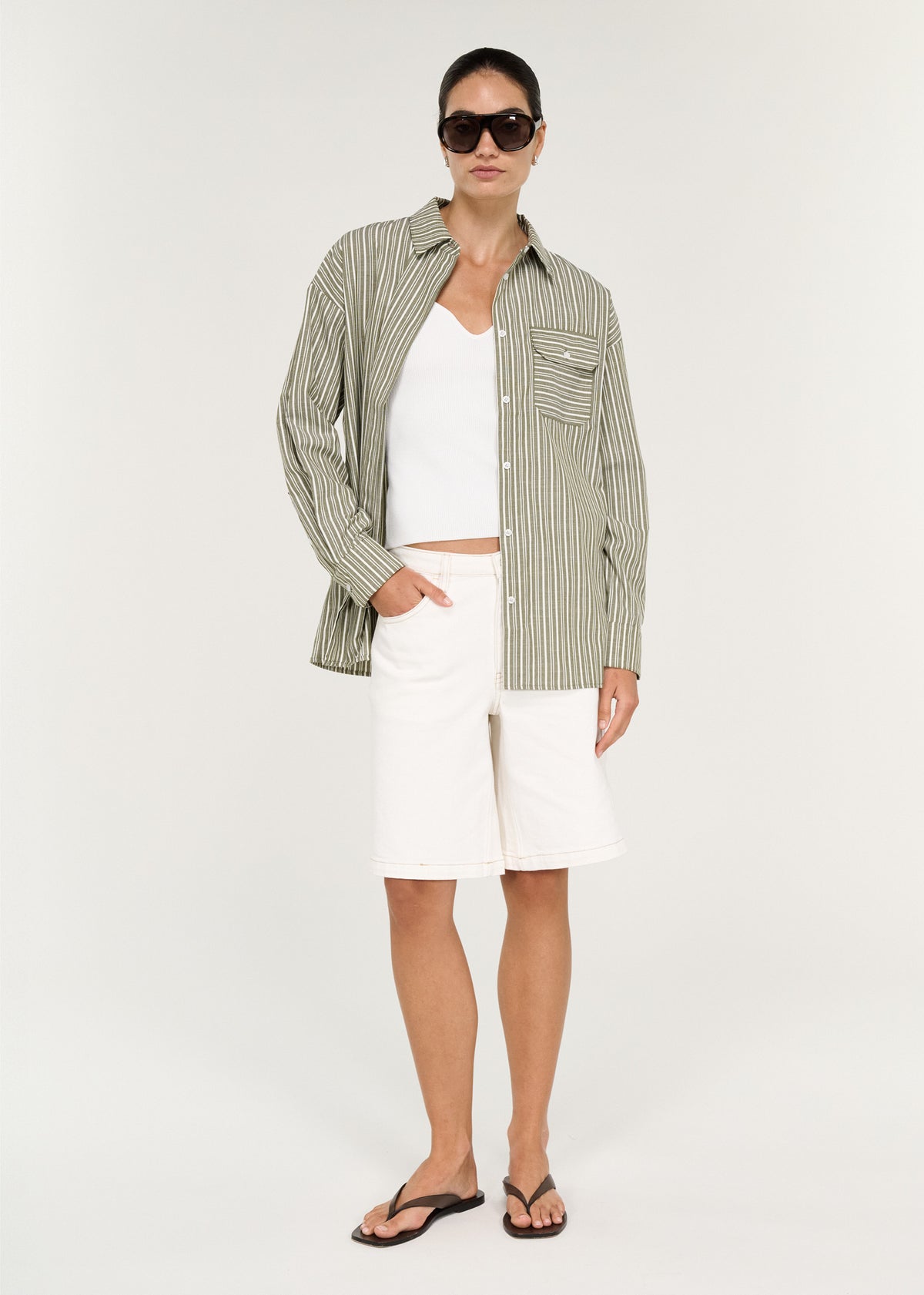 Model wearing Khaki Stripe Cotton Oversized Shirt, showing a classic shirt collar and a button-through front.