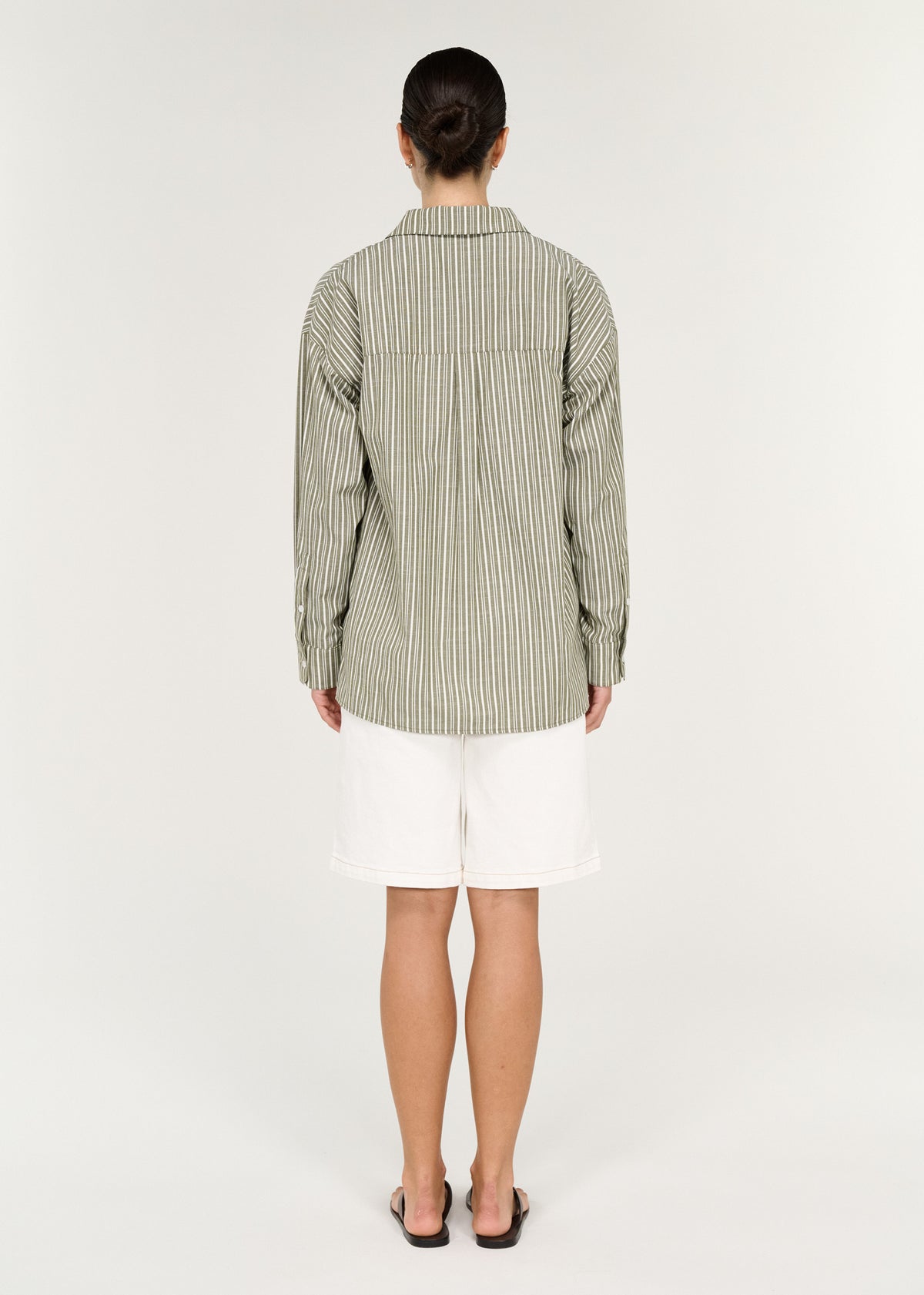 Back view of the Khaki Stripe Cotton Oversized Shirt with a button-through front and long sleeves with buttoned cuffs.