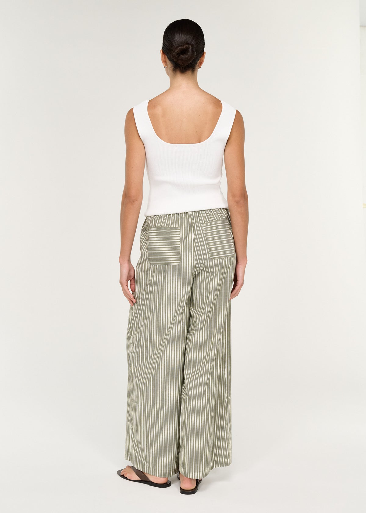 Back view of the Khaki Stripe Relaxed Cotton Pant, showing an adjustable drawstring tie and back patch pockets.