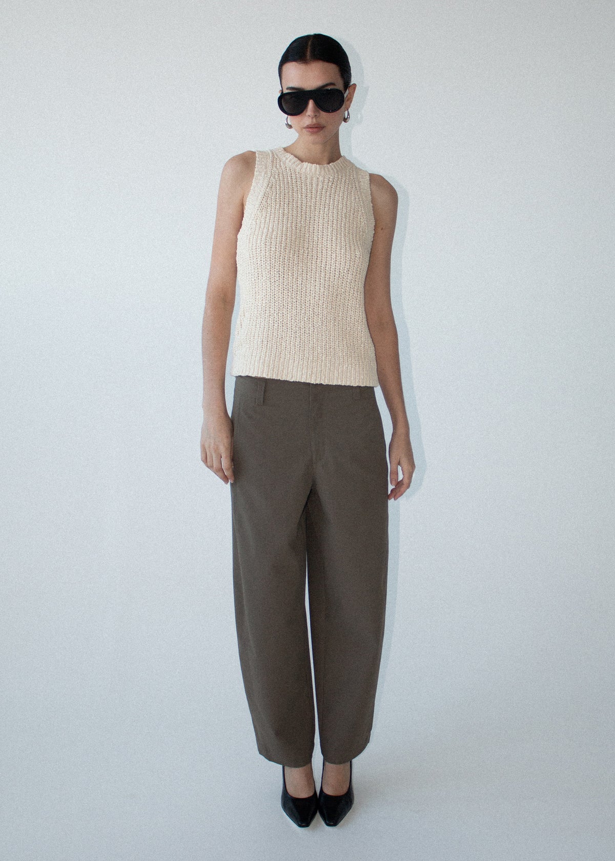 Model wearing Khaki Structured Barrel Leg Pant, showing fixed waistband with belt loops and functional side pockets.