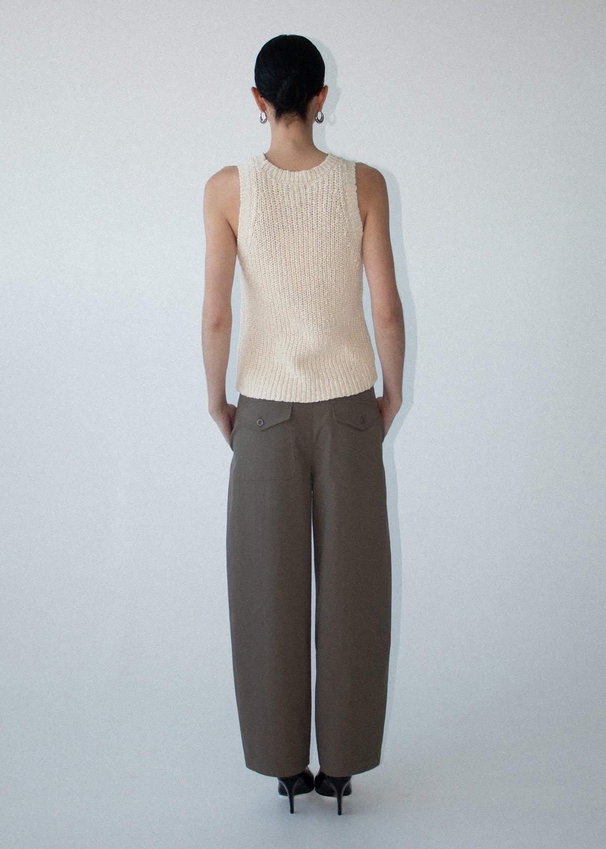 Back view of the Khaki Structured Barrel Leg Pant with a back patch pockets with flap detail and a soft woven fabrication.
