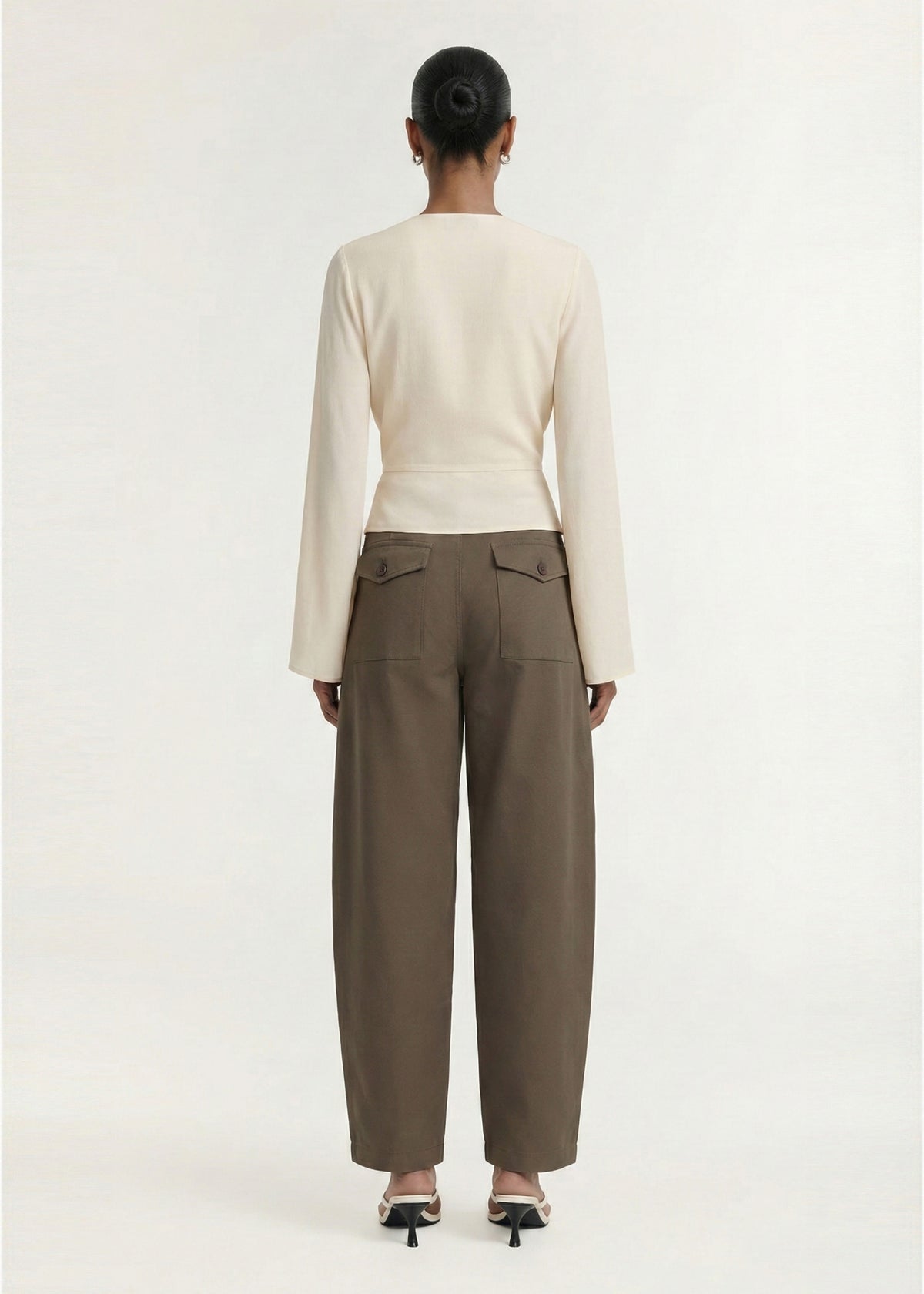 Back view of the Khaki Structured Barrel Leg Pant, showing a back patch pockets with flap detail and a soft woven fabrication.