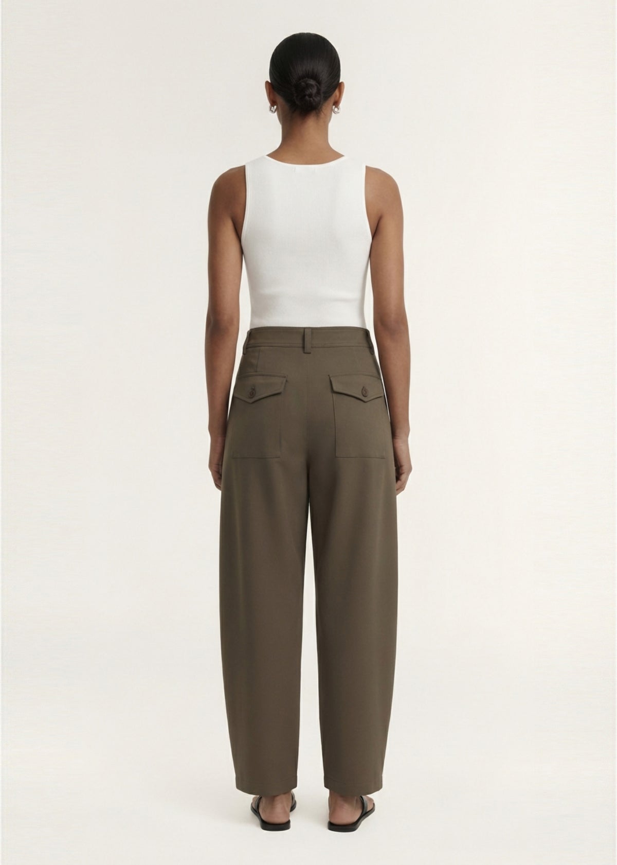 Back view of the Khaki Structured Barrel Leg Pant with a soft woven fabrication and a back patch pockets with flap detail.