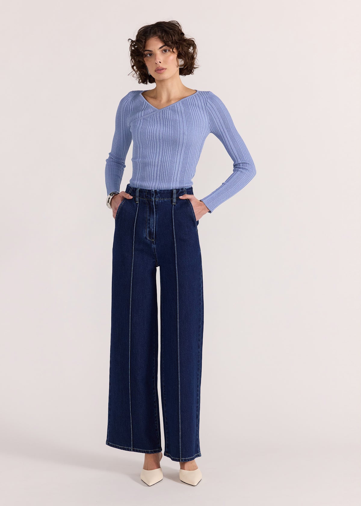 Model wearing Lennox High Waist Jeans, showing a classic five-pocket design.