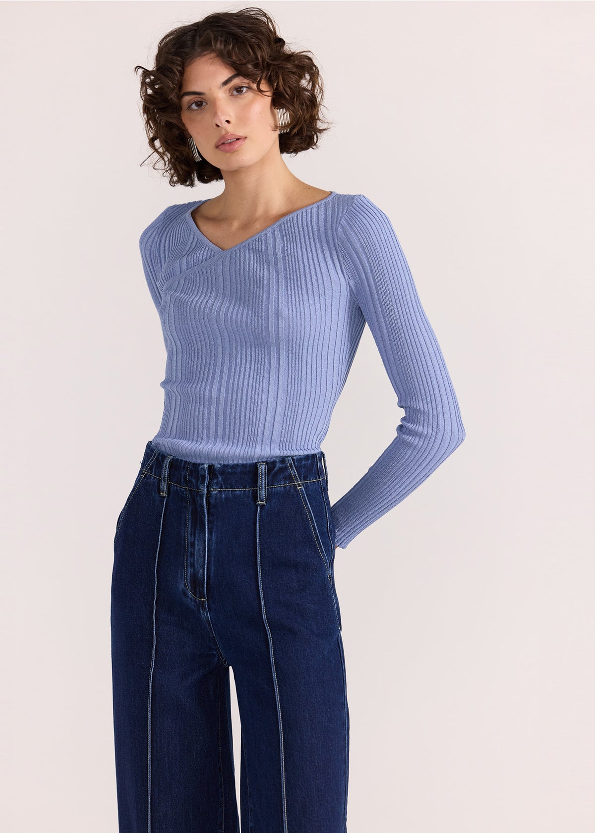 Close-up of the Lennox High Waist Jeans, showing a button and zip fly closure.