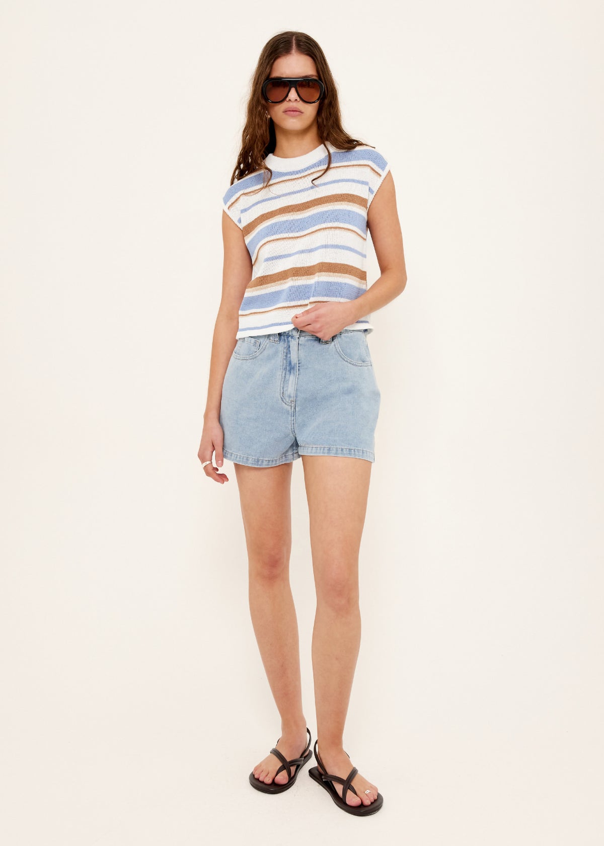 Model wearing Light Blue Denim Shorts, showing a classic five-pocket design and a light vintage blue wash.